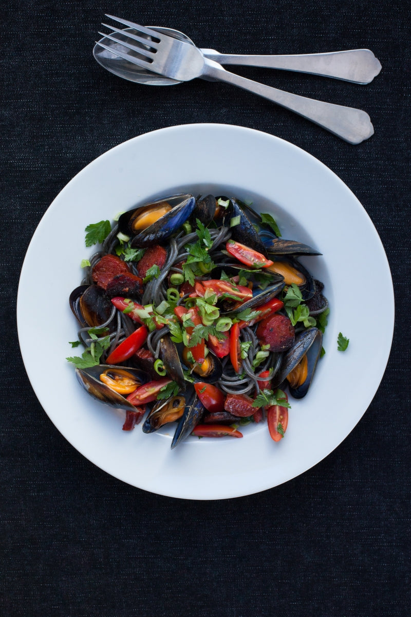 Squid ink spaghetti with mussels, tomatoes, Gubbeen chorizo & fresh herbs by Trish Deseine