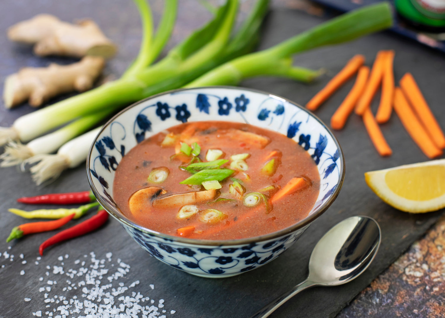 articles/bowl-of-soup-on-table-surrounded-by-vegetables.jpg